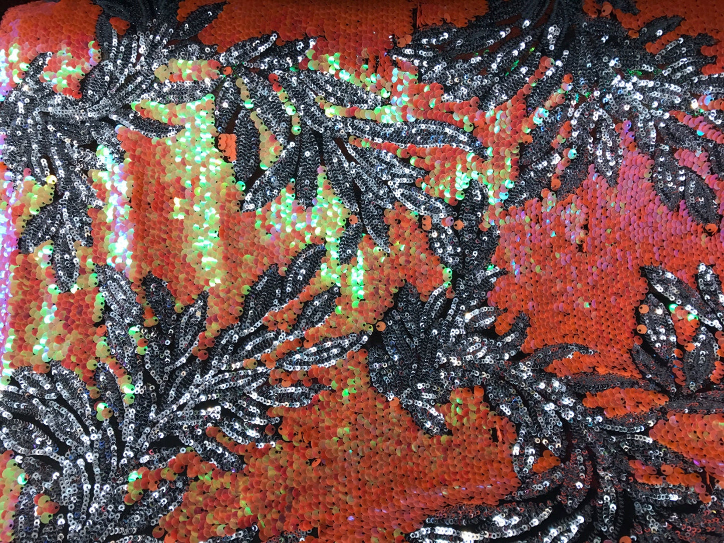 Iridescent Hawaii design 2 tone sequins on mesh base 58/60" sold by the yd. Ships worldwide from Los Angeles California USA