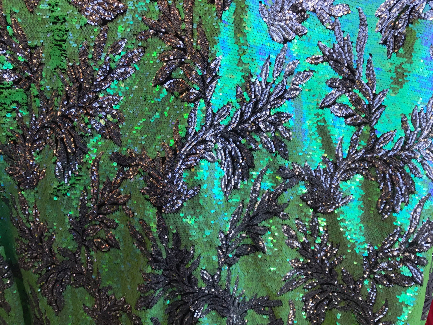 Iridescent Hawaii design 2 tone sequins on mesh base 58/60" sold by the yd. Ships worldwide from Los Angeles California USA