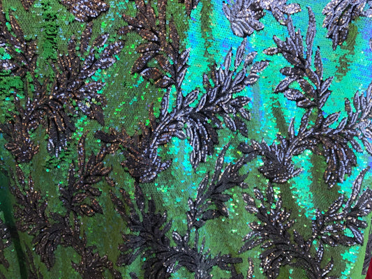 Iridescent Hawaii design 2 tone sequins on mesh base 58/60" sold by the yd. Ships worldwide from Los Angeles California USA