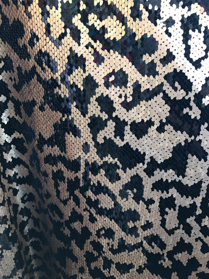 Animal print 5mm sequins 58/60" on Lycra base 2way stretch. Sold by the yd. Ships worldwide from Los Angeles California USA