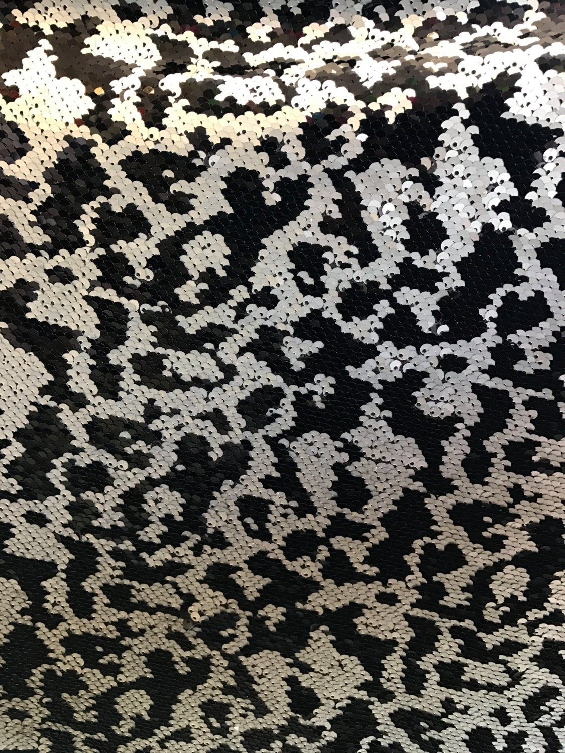 Animal print 5mm sequins 58/60" on Lycra base 2way stretch. Sold by the yd. Ships worldwide from Los Angeles California USA