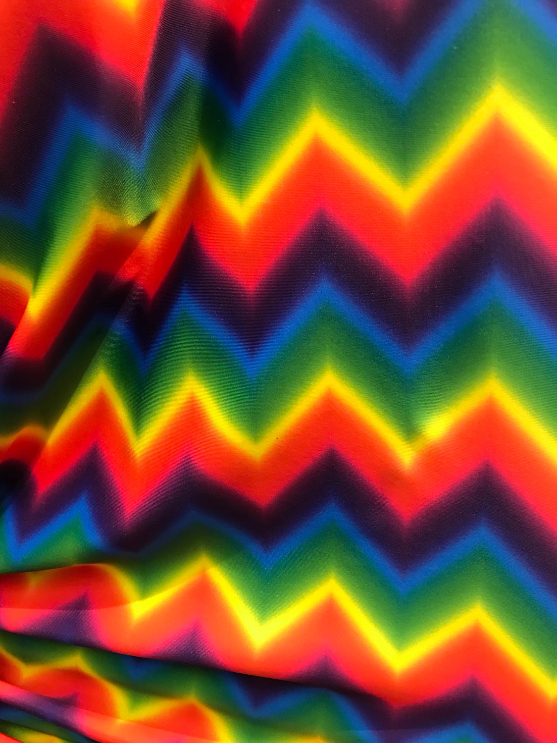 Multicolor chevron design on nylon spandex 4way Stretch 58/60" Sold by the YD. Ships worldwide from Los Angeles California USA