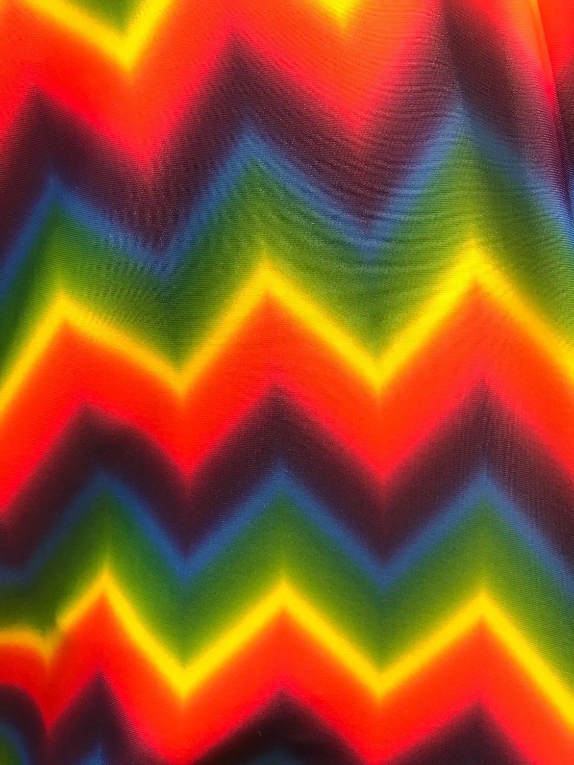 Multicolor chevron design on nylon spandex 4way Stretch 58/60" Sold by the YD. Ships worldwide from Los Angeles California USA