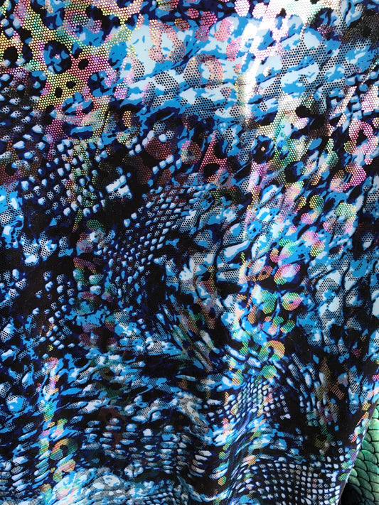 Hologram snake design with ilusión foil all over nylon spandex 4way Stretch 58/60" Sold by the YD. Ships worldwide from Los Angeles CA, USA