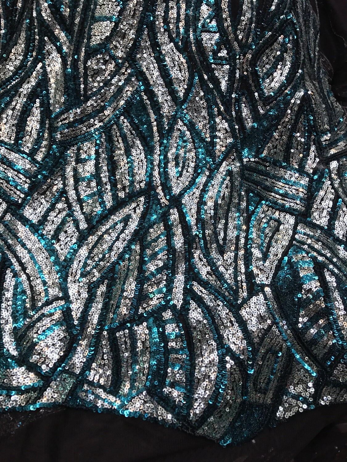Peacock/silver glitz sequins Leaf Design one side border with mesh base 2way 54/55" Sold by the YD. Ships worldwide from Los Angeles CA, US