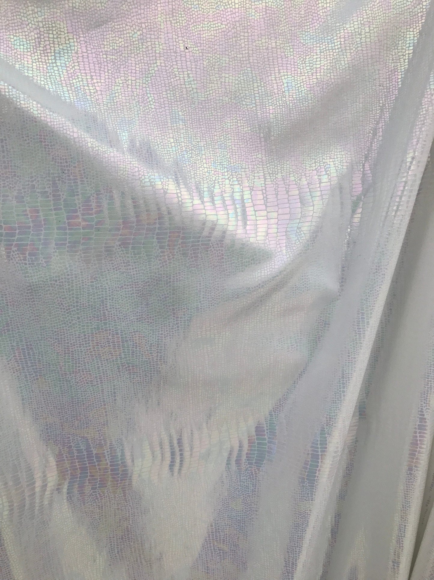 Iridescent snake design Hologram metallic foil on nylon spandex 4way Stretch 58/60" Sold by the YD. Ships worldwide from Los Angeles CA USA