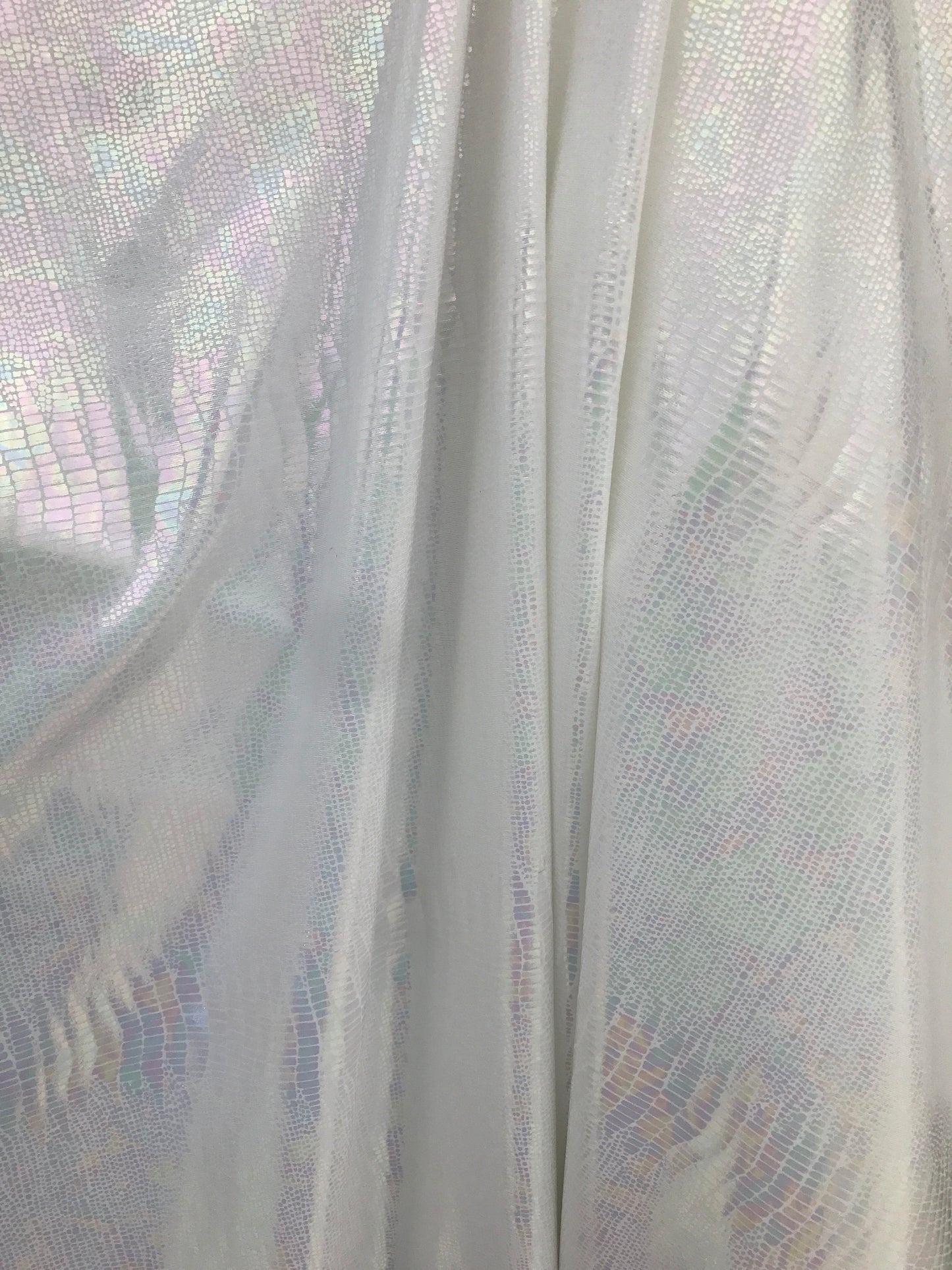 Iridescent snake design Hologram metallic foil on nylon spandex 4way Stretch 58/60" Sold by the YD. Ships worldwide from Los Angeles CA USA