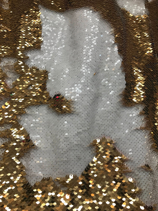 Fantastic new color of flip up sequins white/gold 5mm 2tone seq on spandex  base 58/60" Sold by the YD. Ships worldwide from Los Angeles CA