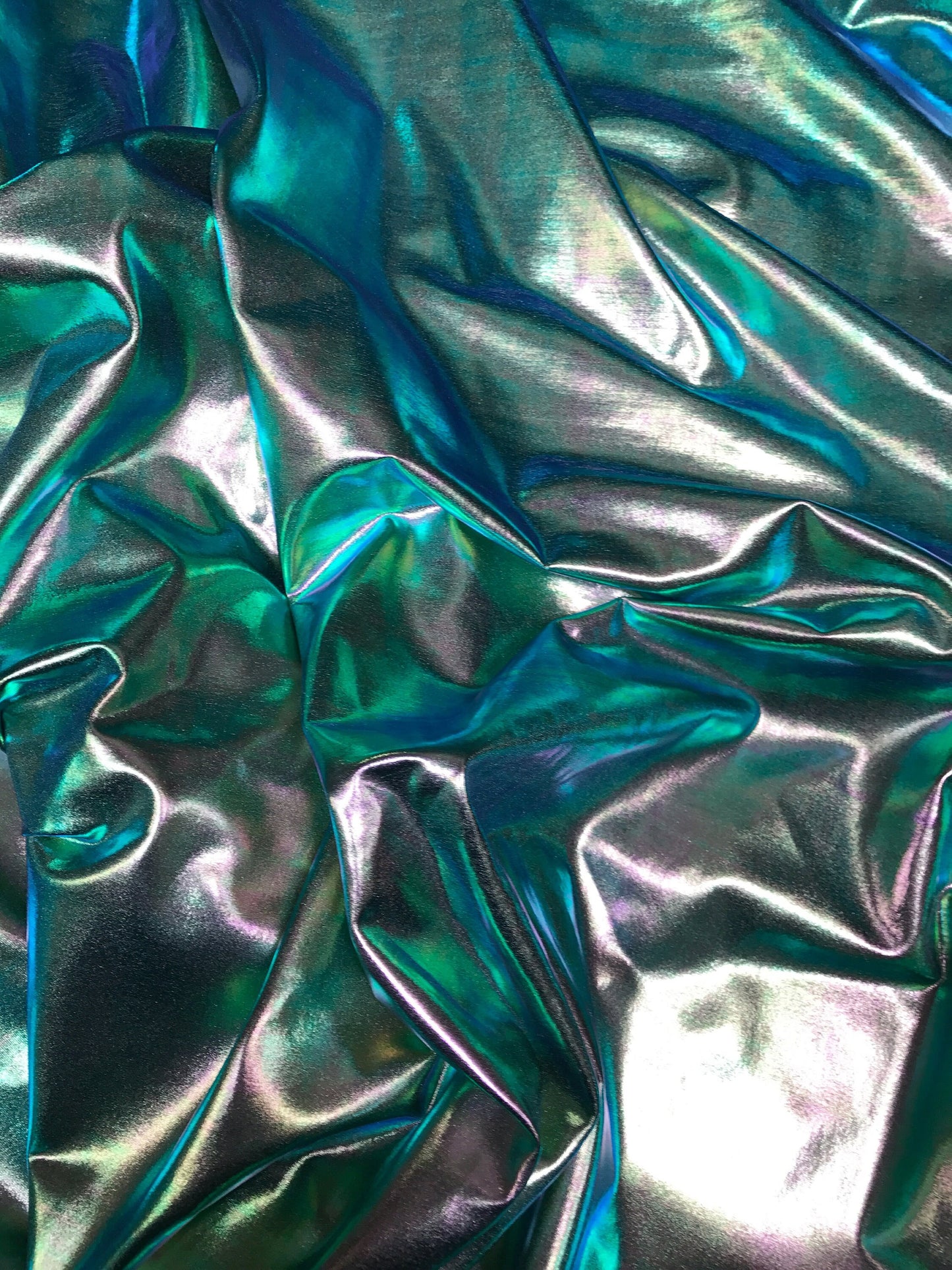 All over foil iridescent green foil on nylon spandex 4way stretch 58/60" 80%nylon; 20 span Sold by the YD. Ships worldwide from Los Ángeles.