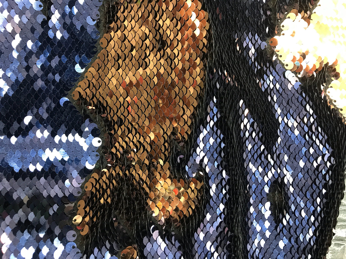 New flip up sequins Navy/bronce  on spandex base2 way stretch  58/60" Sold by the YD. Ships worldwide from Los Angeles California.