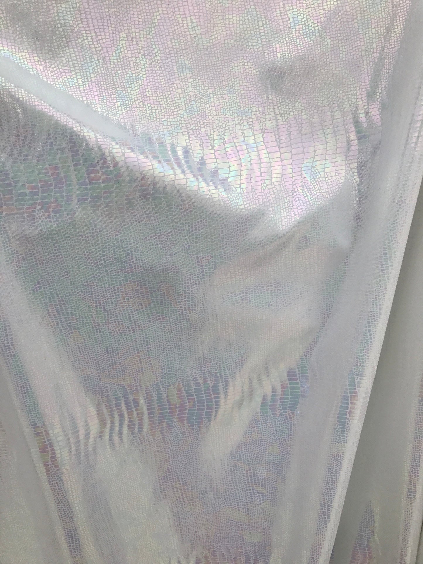 Iridescent snake design Hologram metallic foil on nylon spandex 4way Stretch 58/60" Sold by the YD. Ships worldwide from Los Angeles CA USA