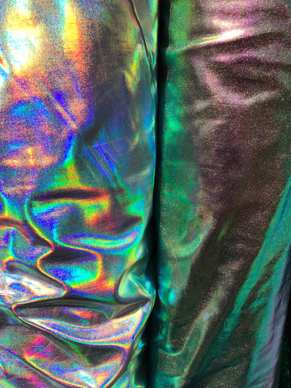 All over foil iridescent silver and Iridescent green color nylon spandex 4way stretch 58/60" Sold by the YD. Ships from Los Ángeles CA USA