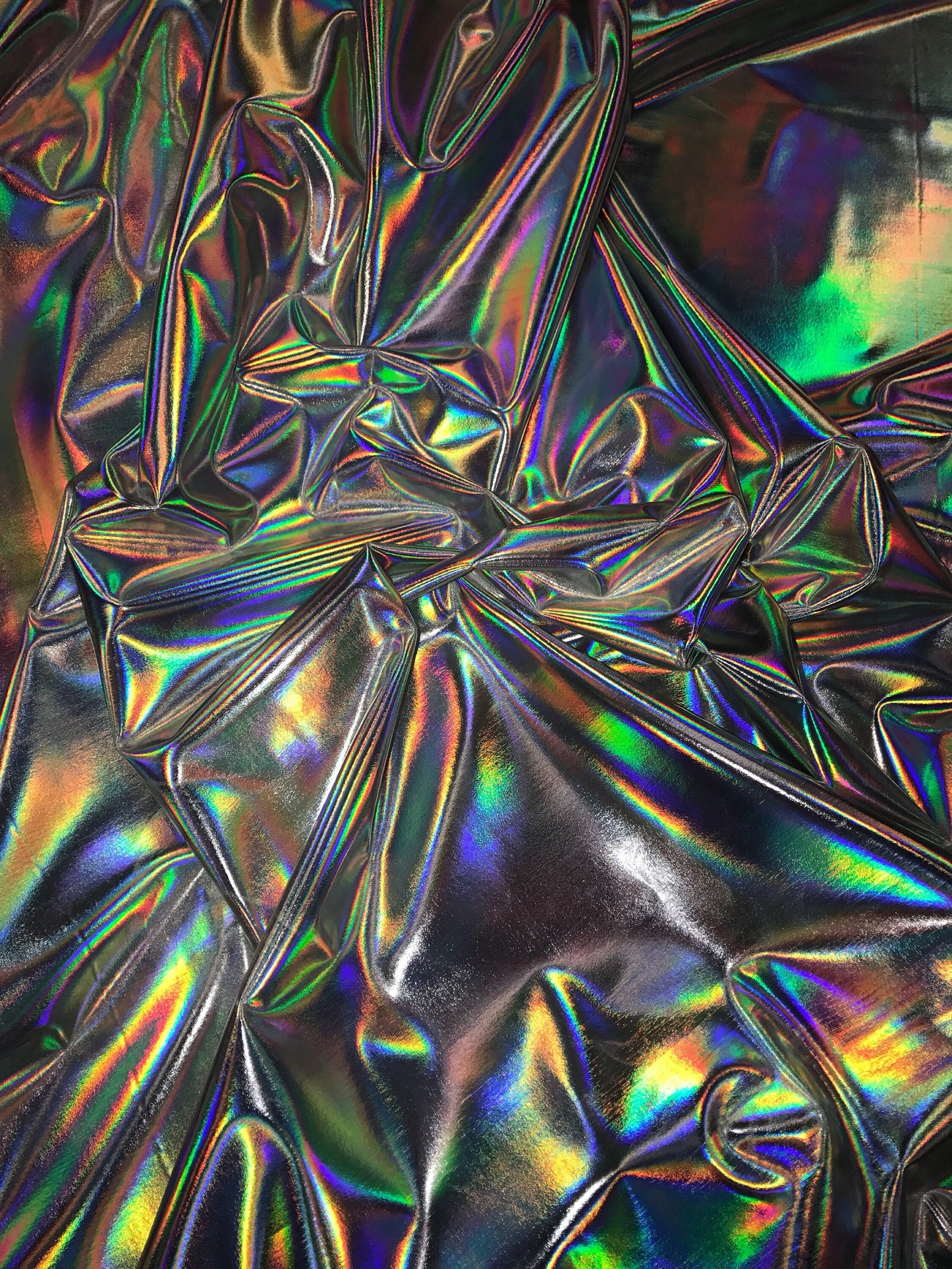 Iridescent silver all over foil metallic nylon Spandex 4way stretch 58/60" Sold by the YD. Ships worldwide from Los Angeles California USA