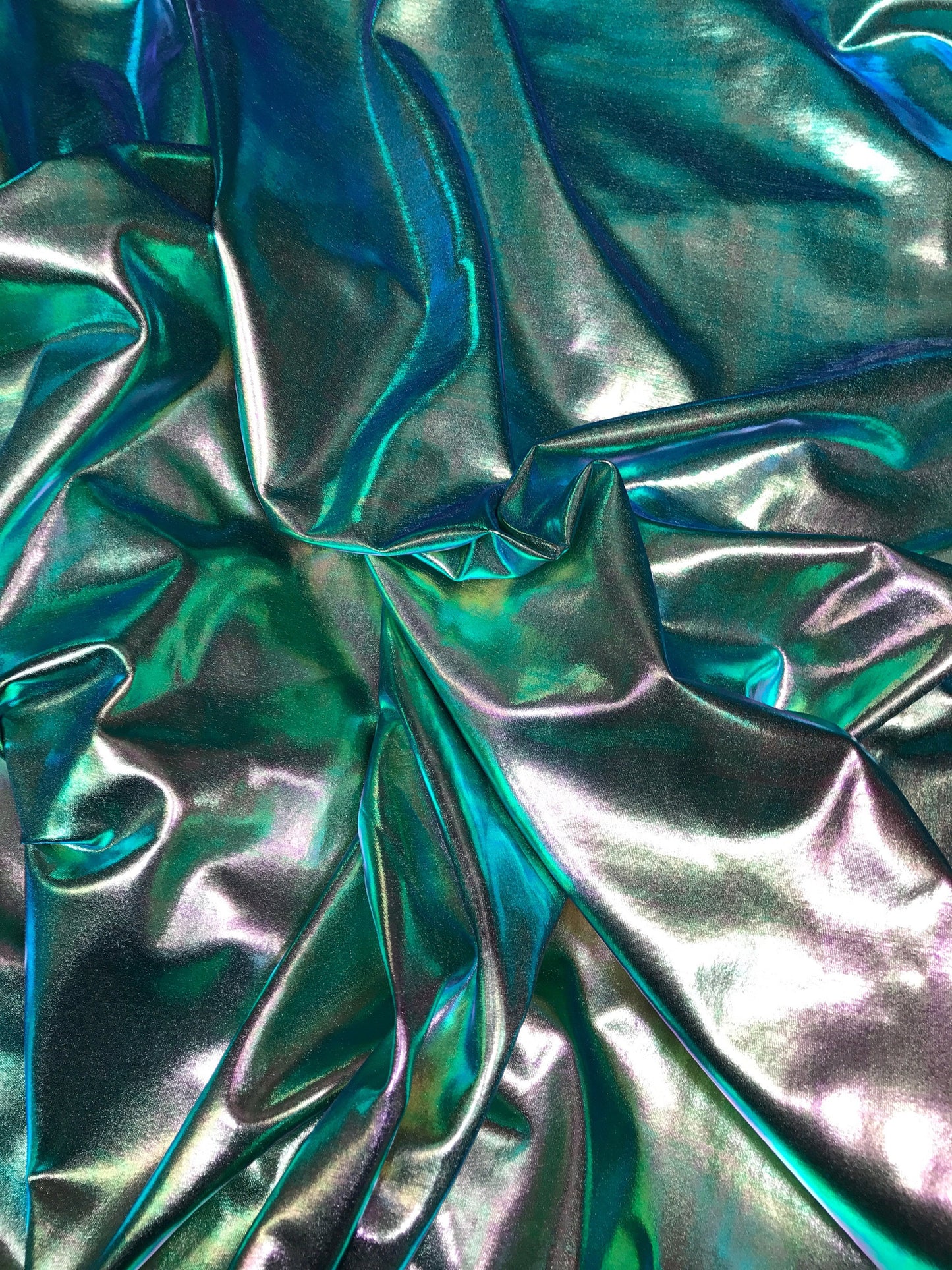 All over foil iridescent green foil on nylon spandex 4way stretch 58/60" 80%nylon; 20 span Sold by the YD. Ships worldwide from Los Ángeles.