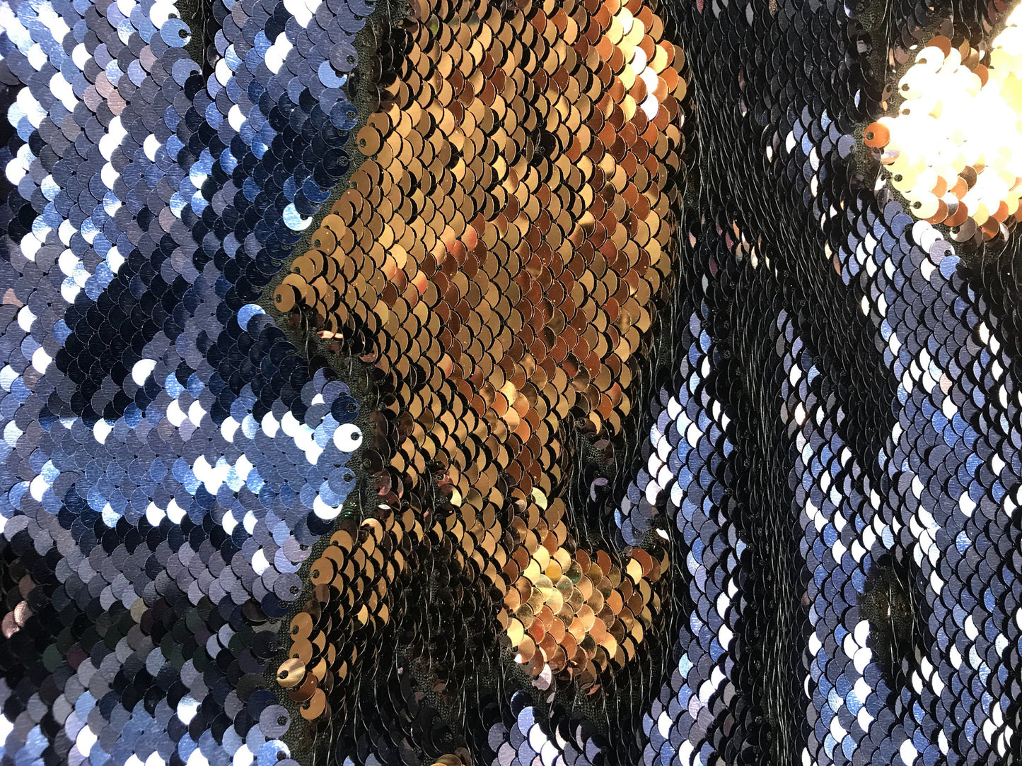 New flip up sequins Navy/bronce  on spandex base2 way stretch  58/60" Sold by the YD. Ships worldwide from Los Angeles California.