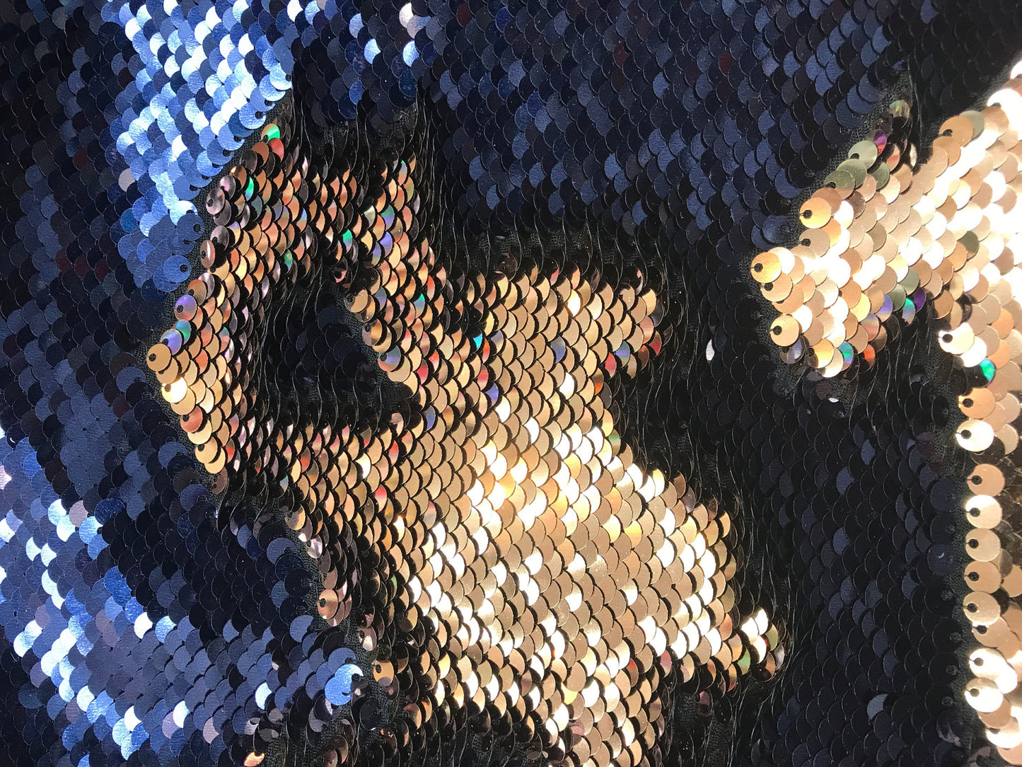 New flip up sequins Navy/bronce  on spandex base2 way stretch  58/60" Sold by the YD. Ships worldwide from Los Angeles California.