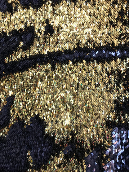 Black/gold flip up sequins reversible sequins on spandex base 2way stretch 58/60" Sold by the YD. Ships worldwide from Los Angeles CA USA.
