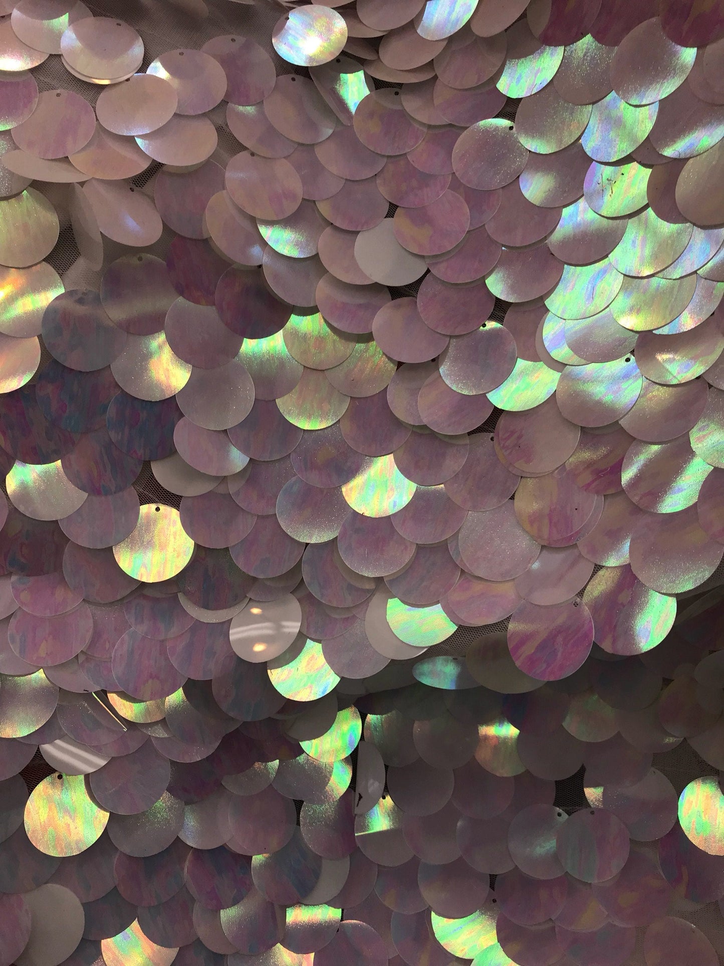 New iridescent white jumbo sequins it comes with stretch mesh 2way base 58/60" Sold by the YD. Ships worldwide from Los Angeles CA USA