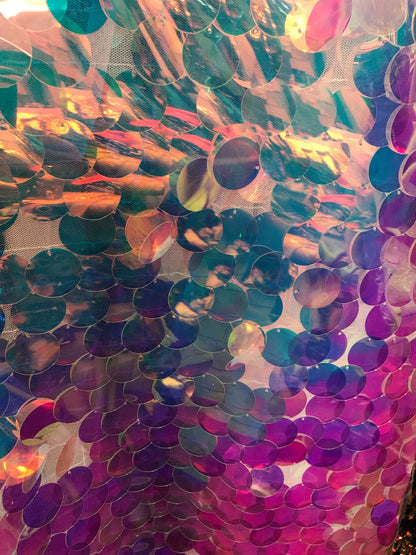 Iridescent white clear jumbo sequins it comes with stretch mesh 2way base 58/60" Sold by the YD. Ships worldwide from Los Angeles CA USA