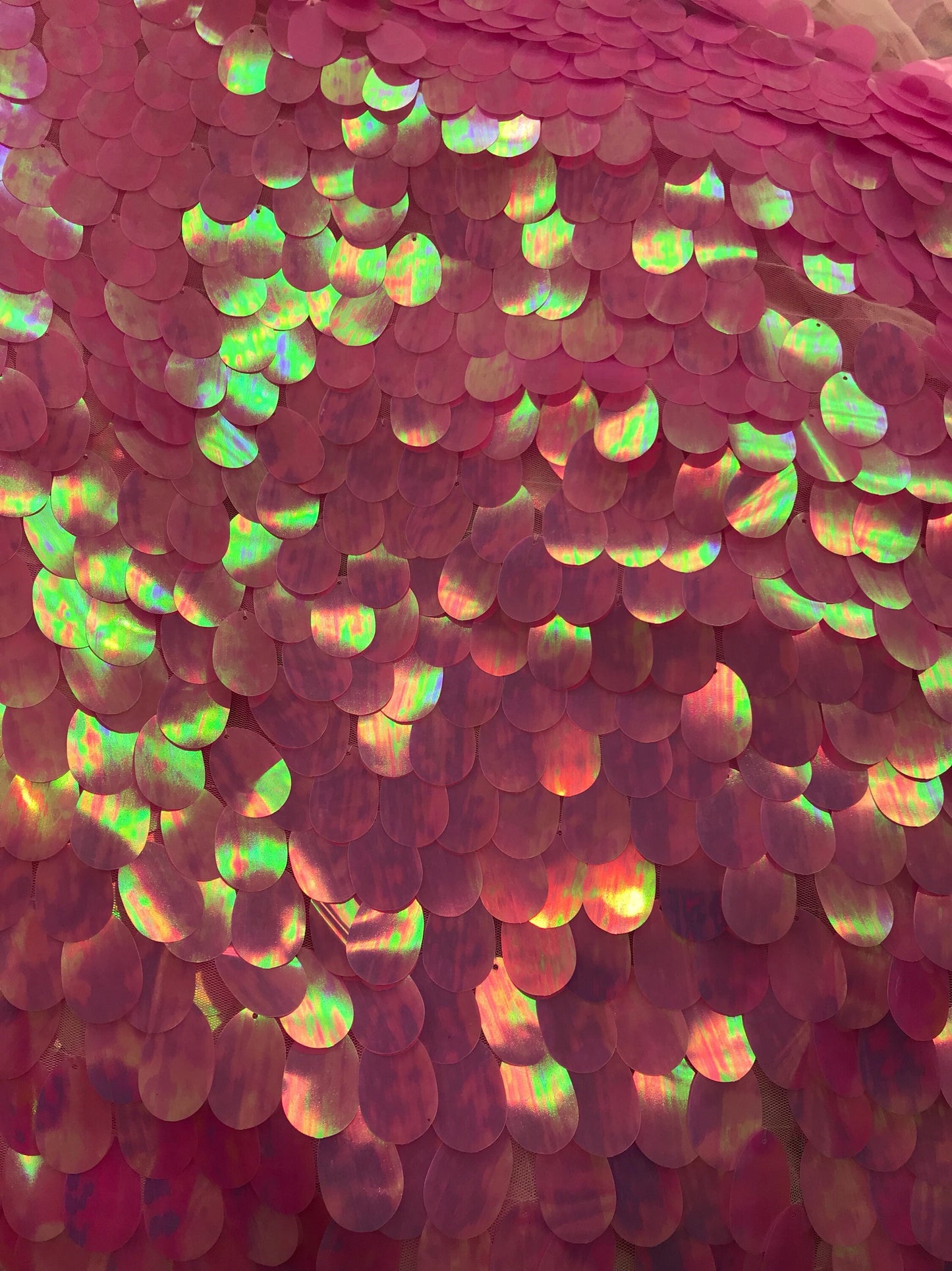 Iridescent candy pink teardrops sequins it comes with stretch mesh 2way base 58/60" Sold by the YD. Ships worldwide from Los Angeles CA