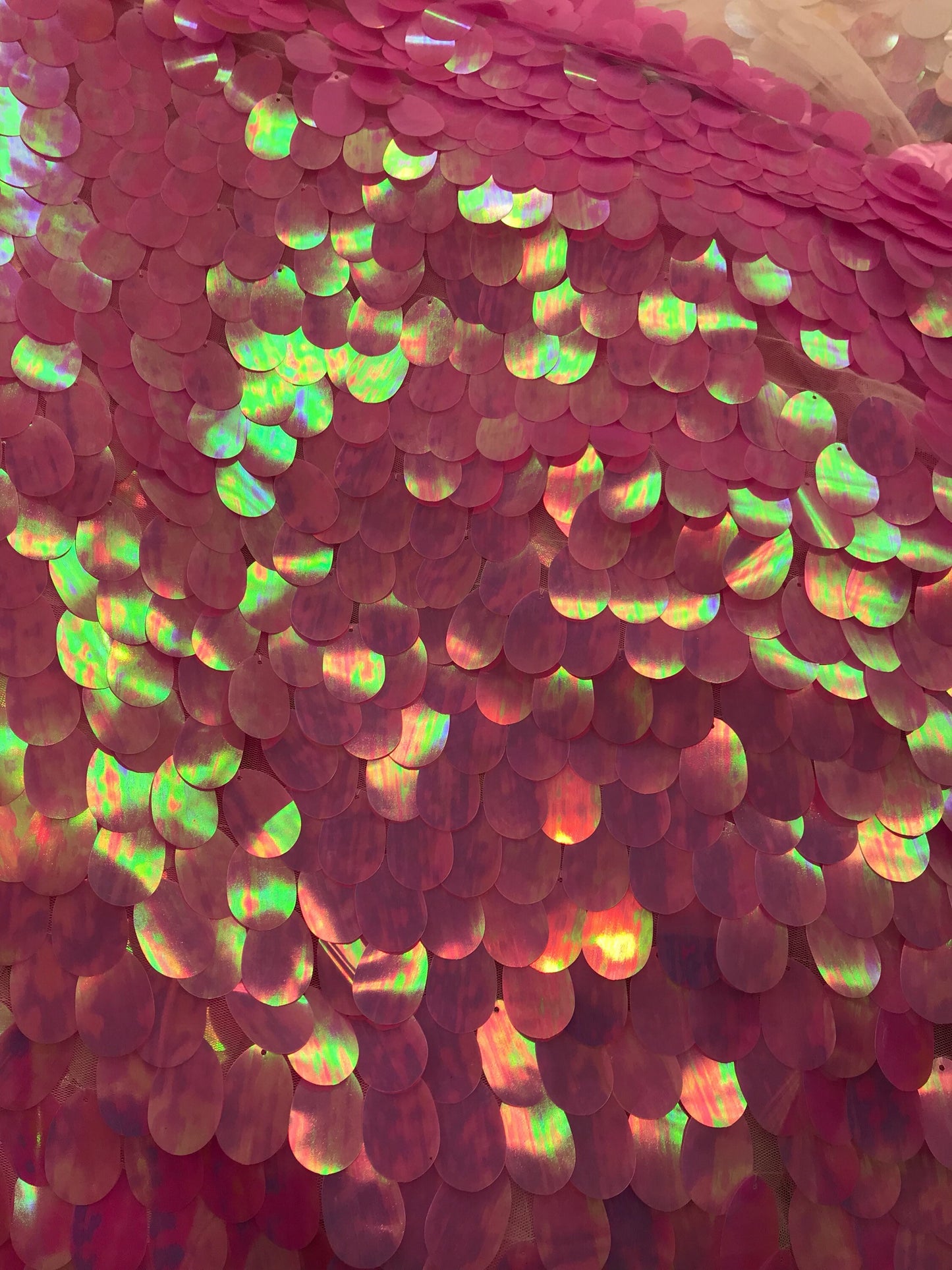 Iridescent candy pink teardrops sequins it comes with stretch mesh 2way base 58/60" Sold by the YD. Ships worldwide from Los Angeles CA