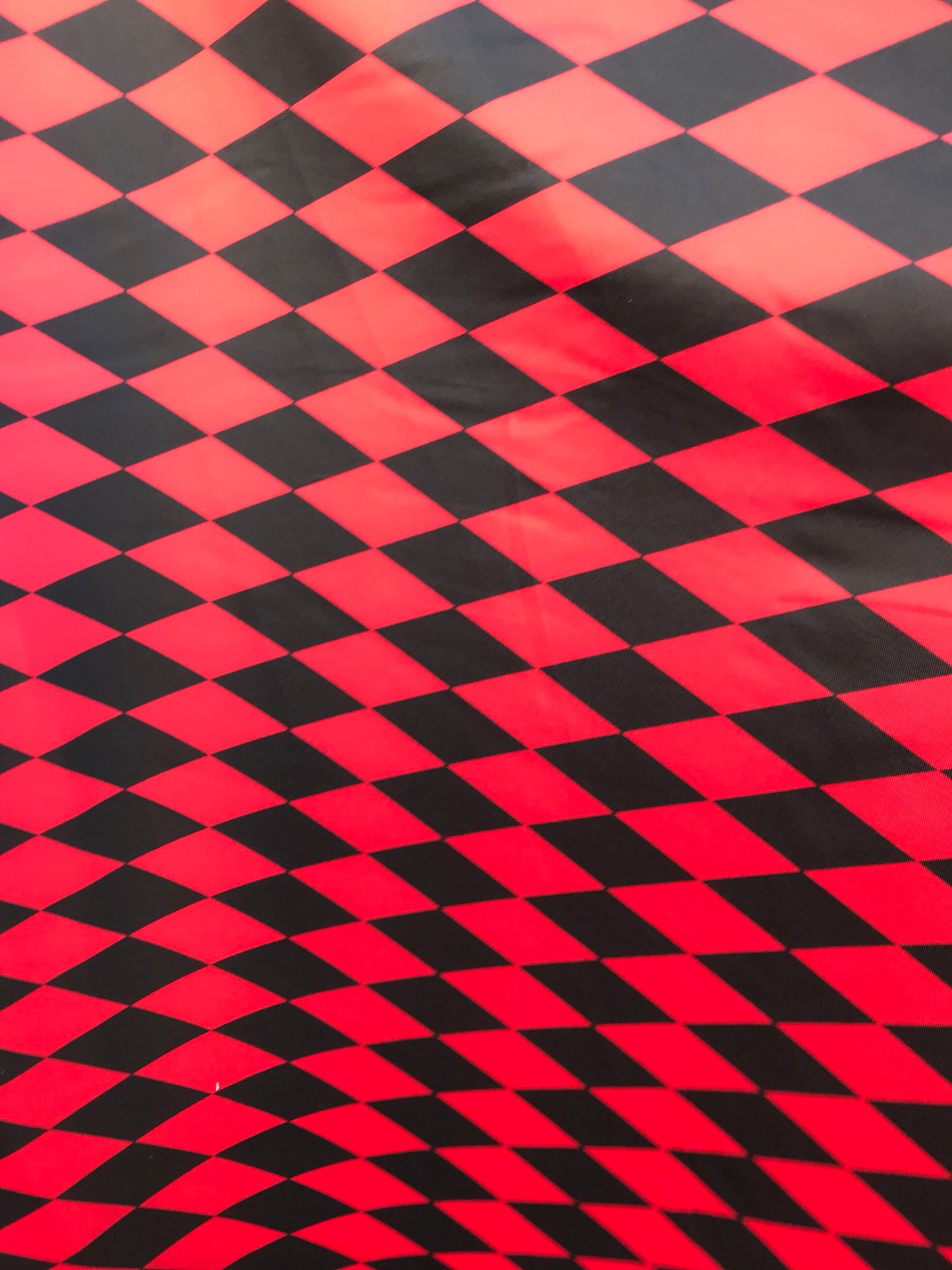 New Diamond Harlequin design black/red nylon spandex 4way stretch 58/60" Sold by the YD. Ships worldwide from Los Angeles California USA