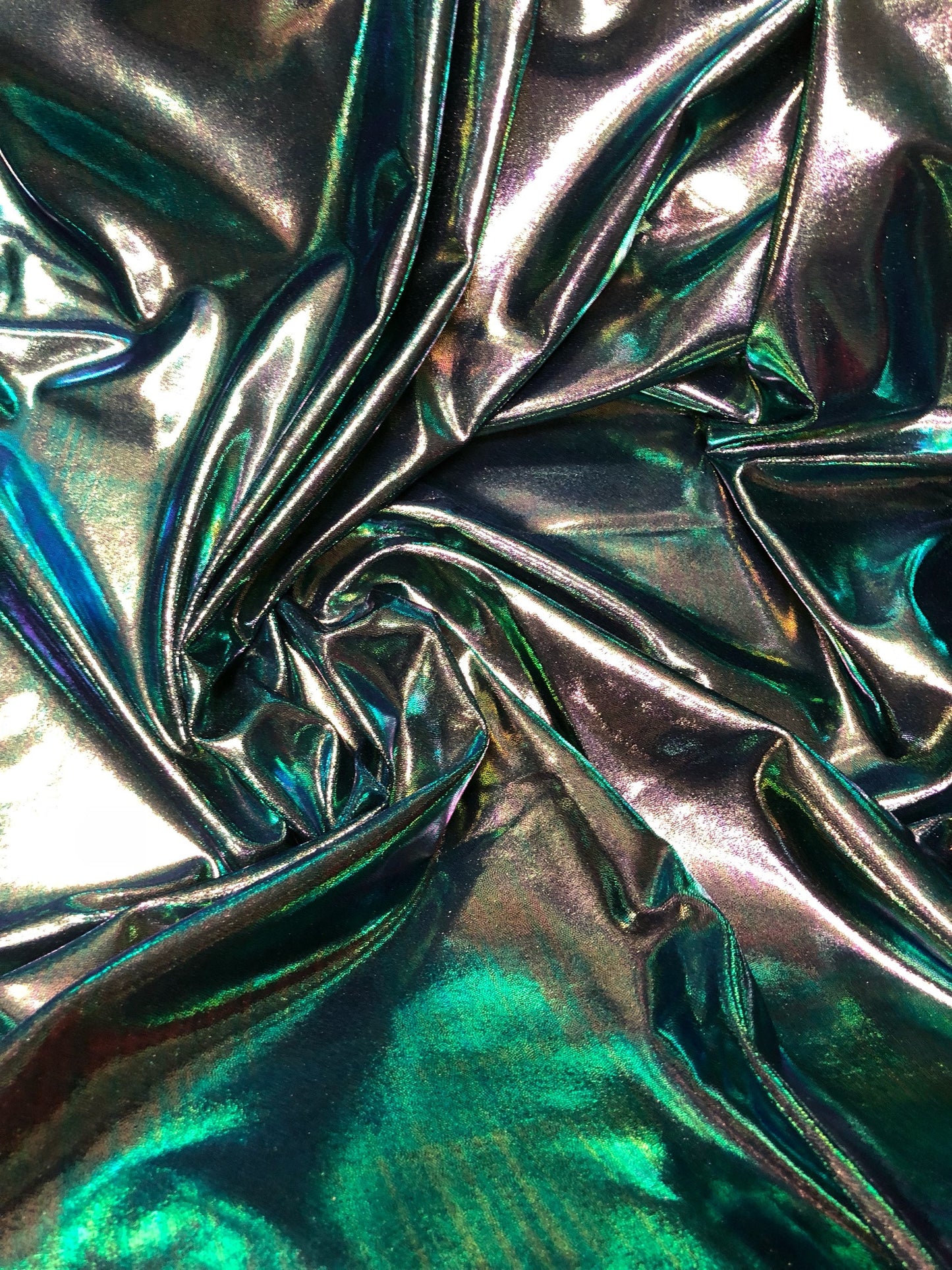 New iridescent foggy foil navy/green oil effect nylon spandex 4way stretch 58/60" Sold by the YD. Ships worldwide from Los Angeles CA.