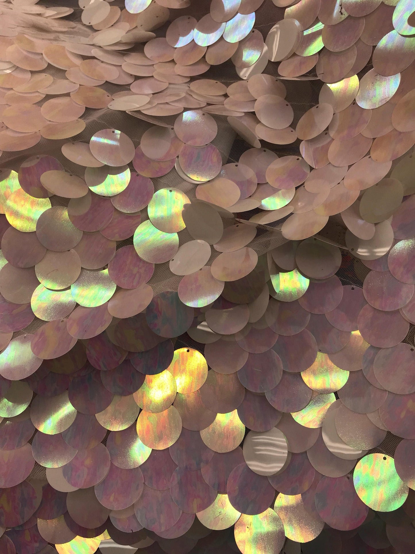 New iridescent white jumbo sequins it comes with stretch mesh 2way base 58/60" Sold by the YD. Ships worldwide from Los Angeles CA USA