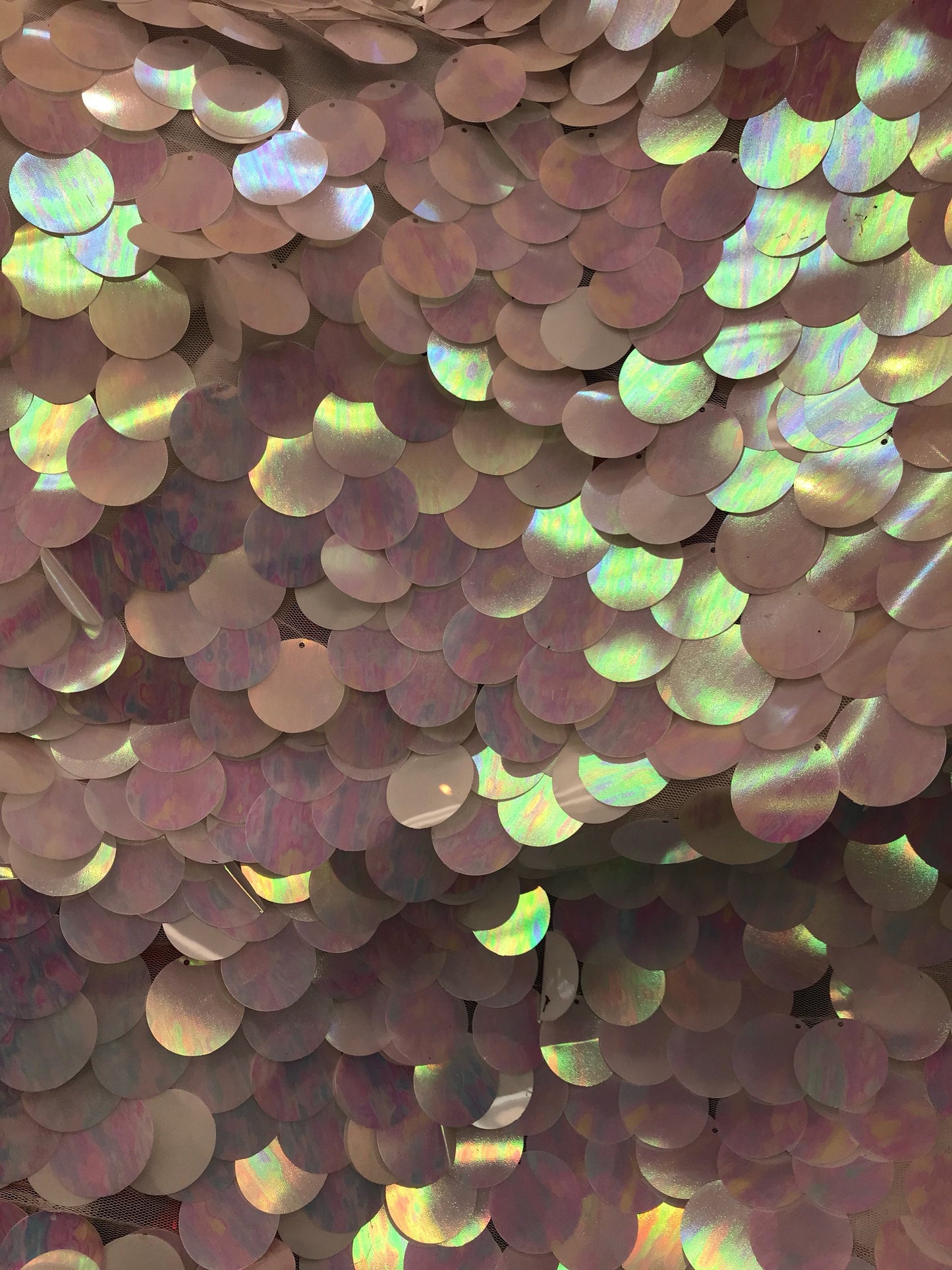 New iridescent white jumbo sequins it comes with stretch mesh 2way base 58/60" Sold by the YD. Ships worldwide from Los Angeles CA USA