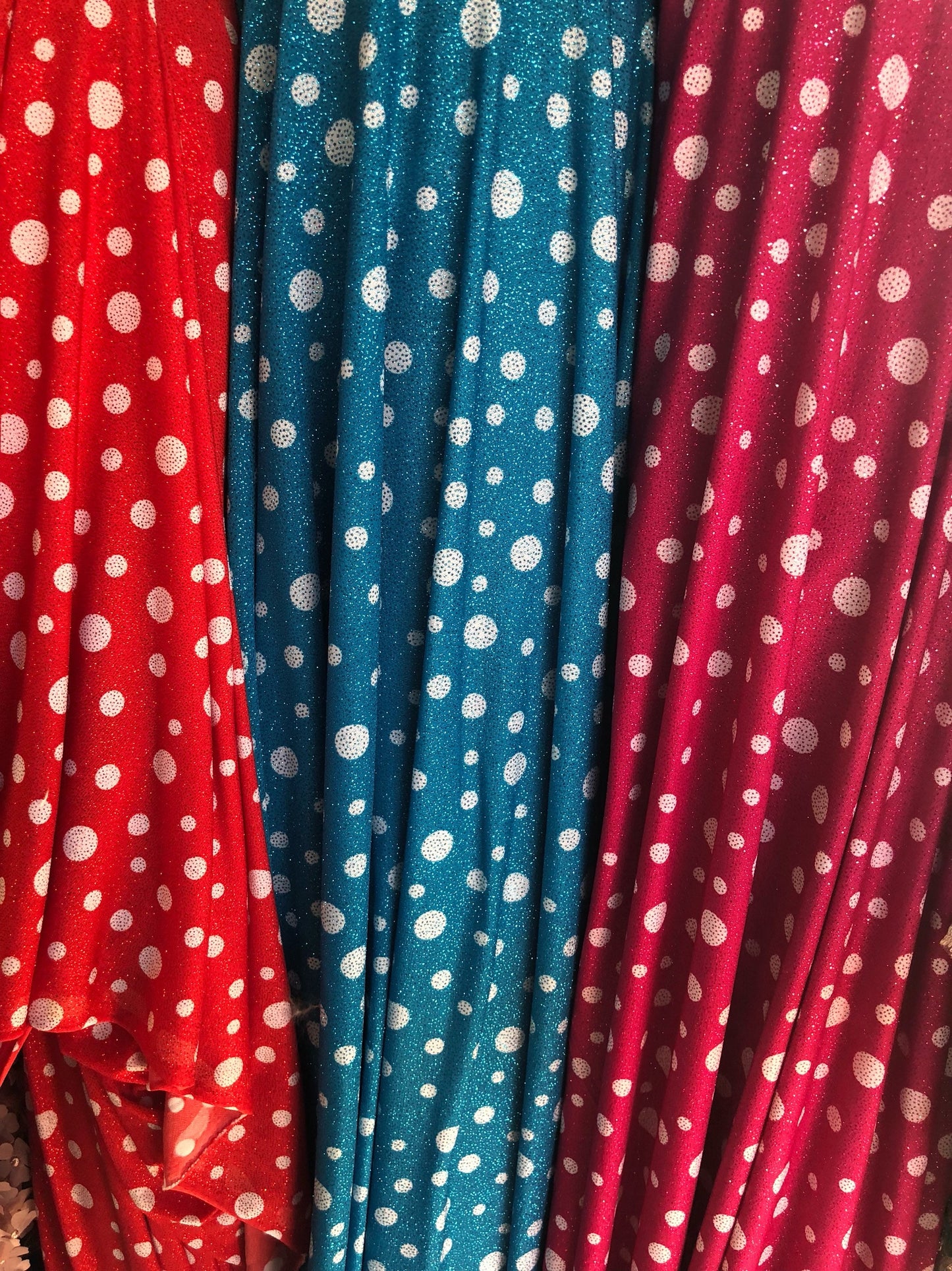 New spandex polka dots Design with glitter 4 way stretch 58/60" Sold by the YD. Ships worldwide from Los Angeles California USA.