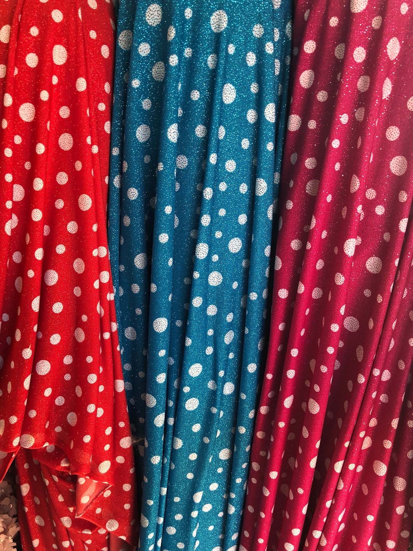 New spandex polka dots Design with glitter 4 way stretch 58/60" Sold by the YD. Ships worldwide from Los Angeles California USA.