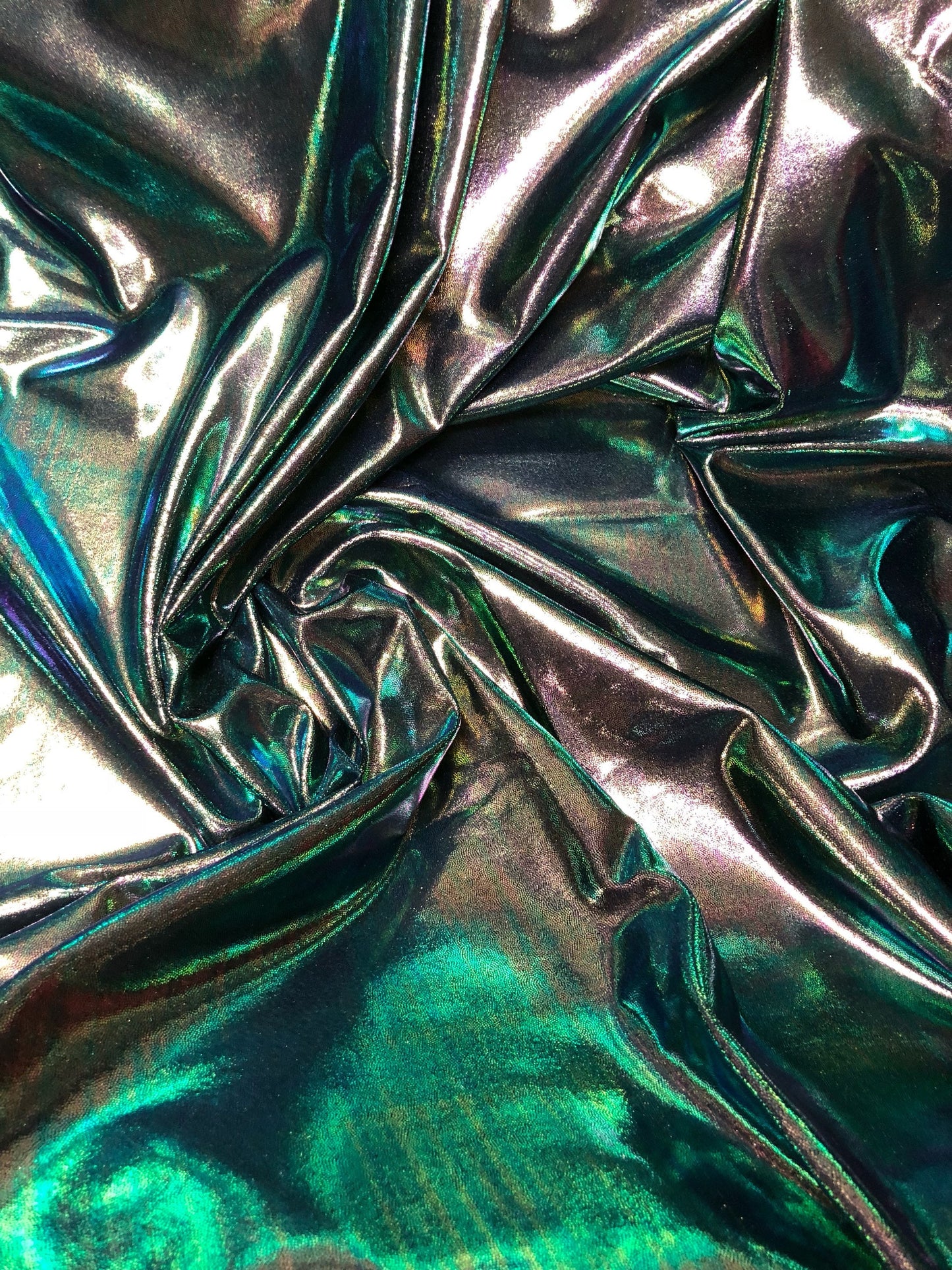 New iridescent foggy foil navy/green oil effect nylon spandex 4way stretch 58/60" Sold by the YD. Ships worldwide from Los Angeles CA.