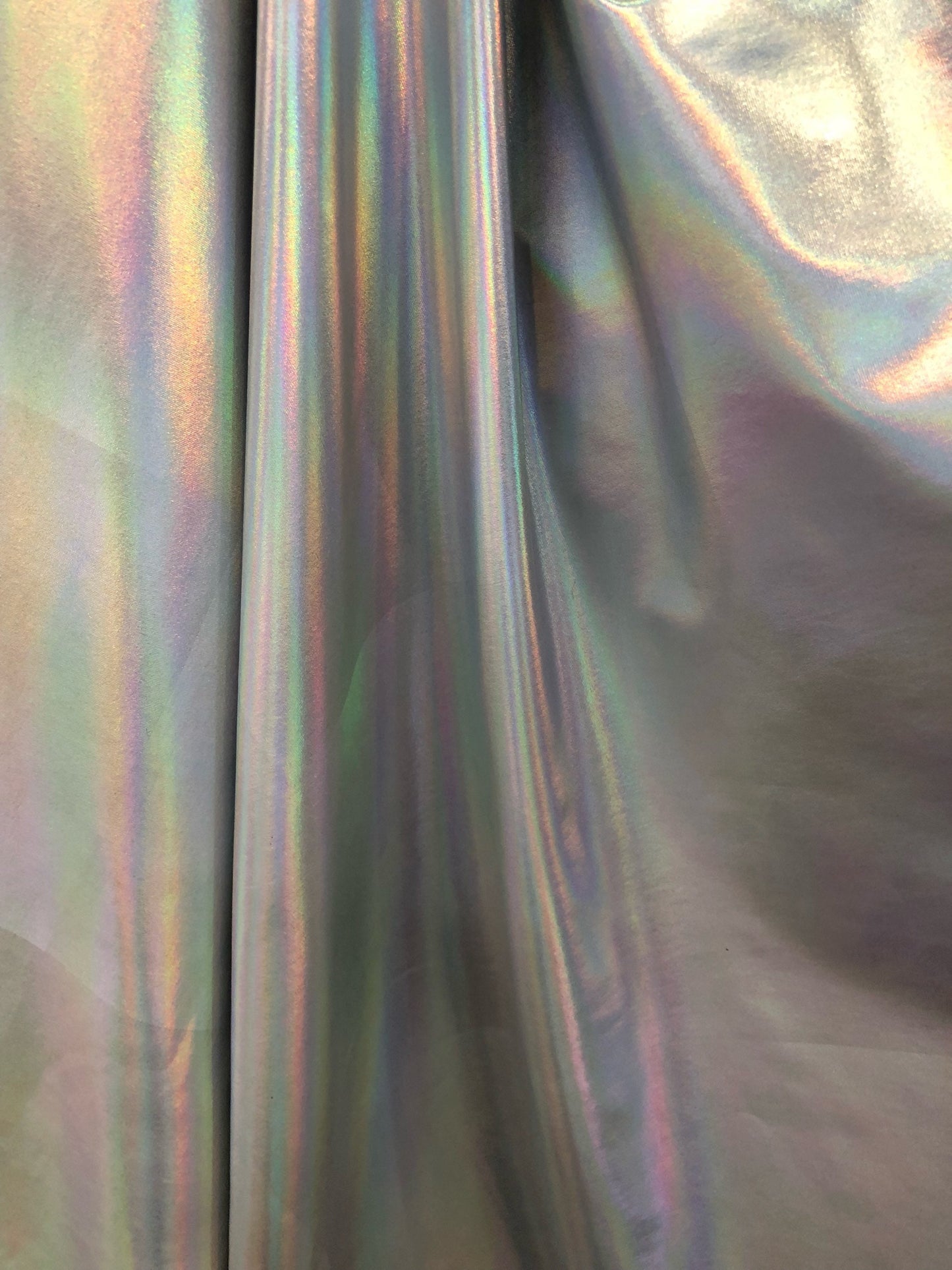 New iridescent all over foil nylon spandex 4way Stretch 58/60" Sold by the YD. Ships worldwide from Los Angeles California USA.