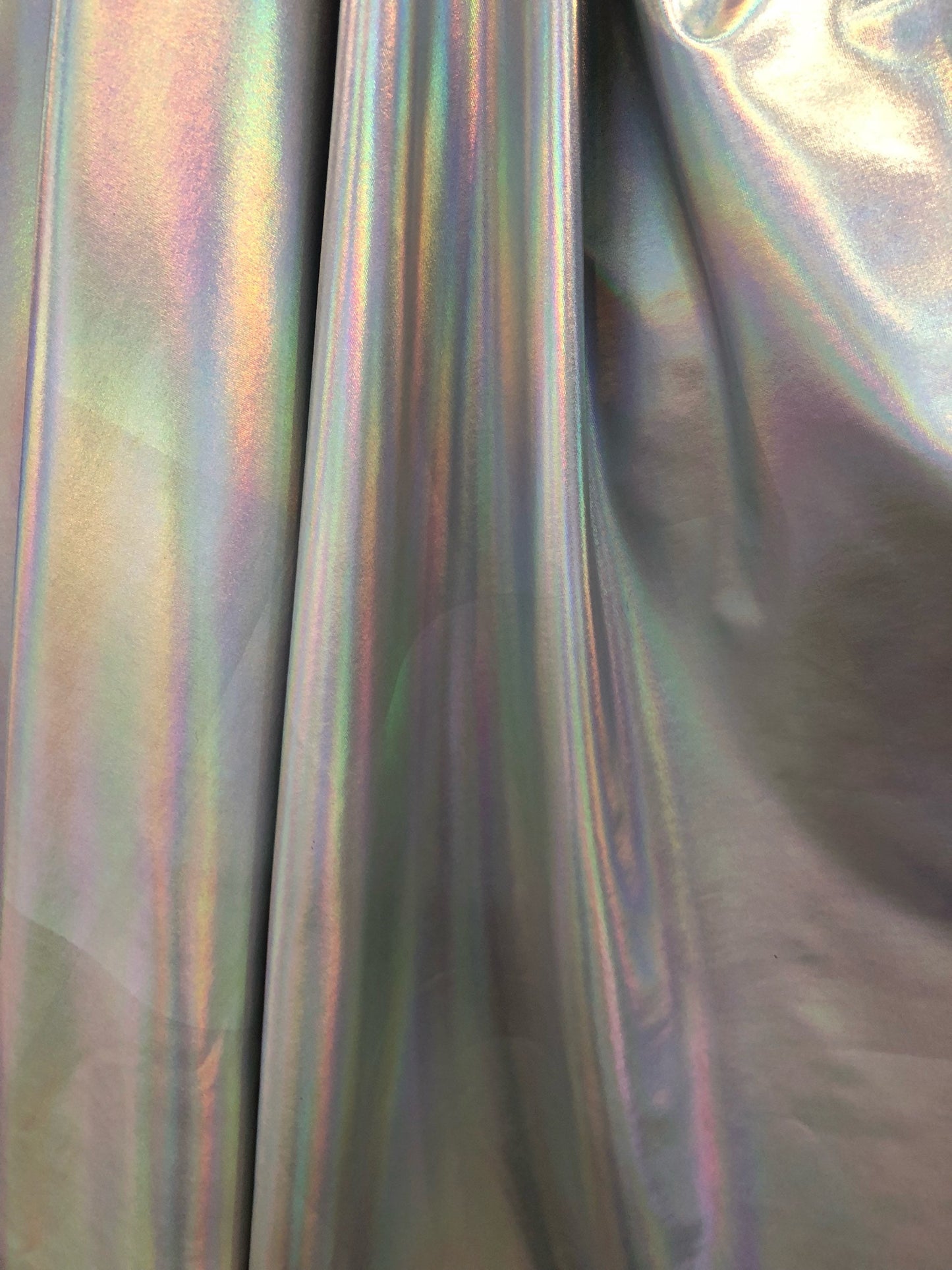New iridescent all over foil nylon spandex 4way Stretch 58/60" Sold by the YD. Ships worldwide from Los Angeles California USA.
