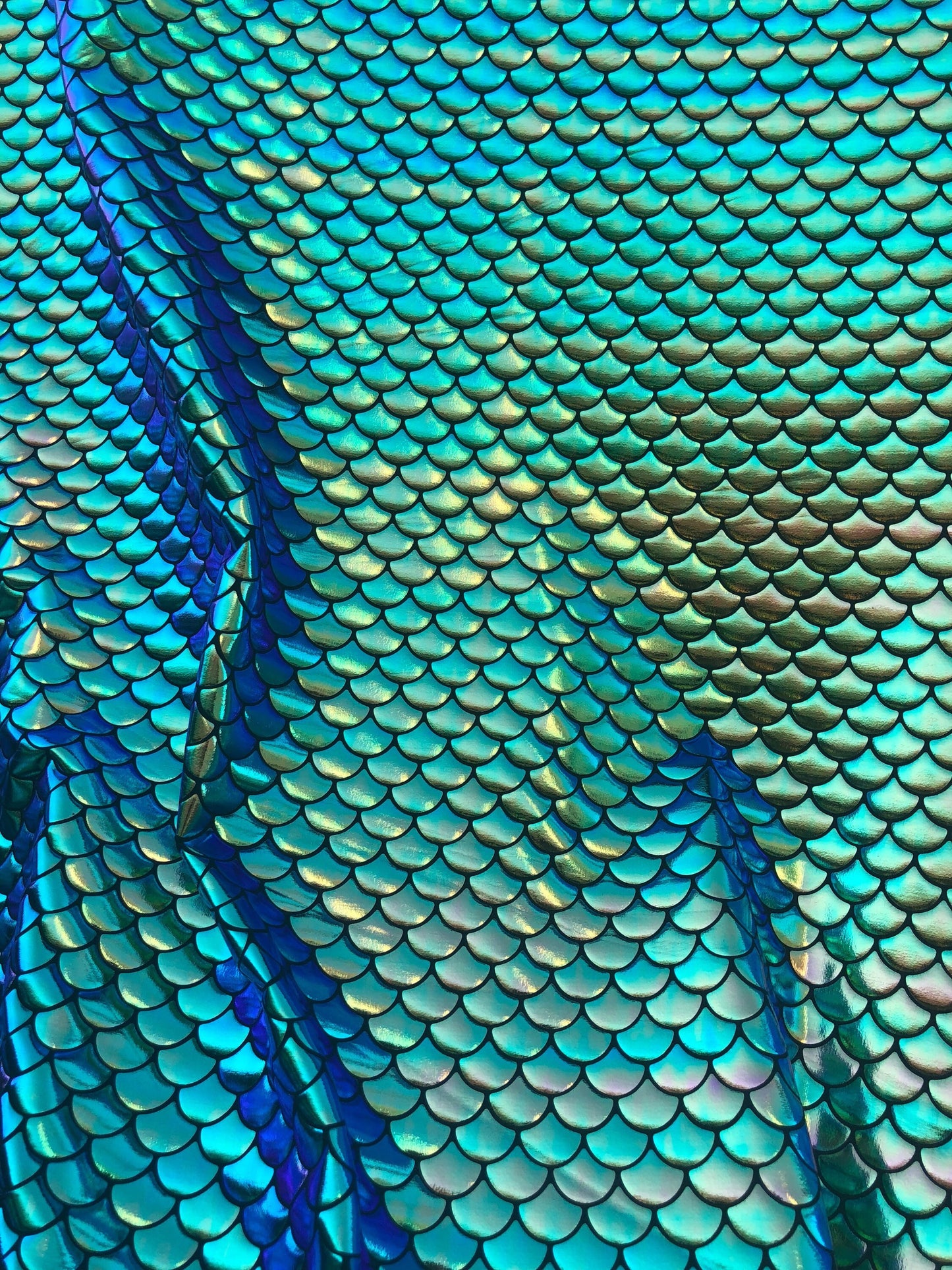 Mermaid design fish scael green with blue turquoise effect Nylon 4way Stretch 58/60" Sold by the YD. Ships worldwide from Los Angeles CA USA