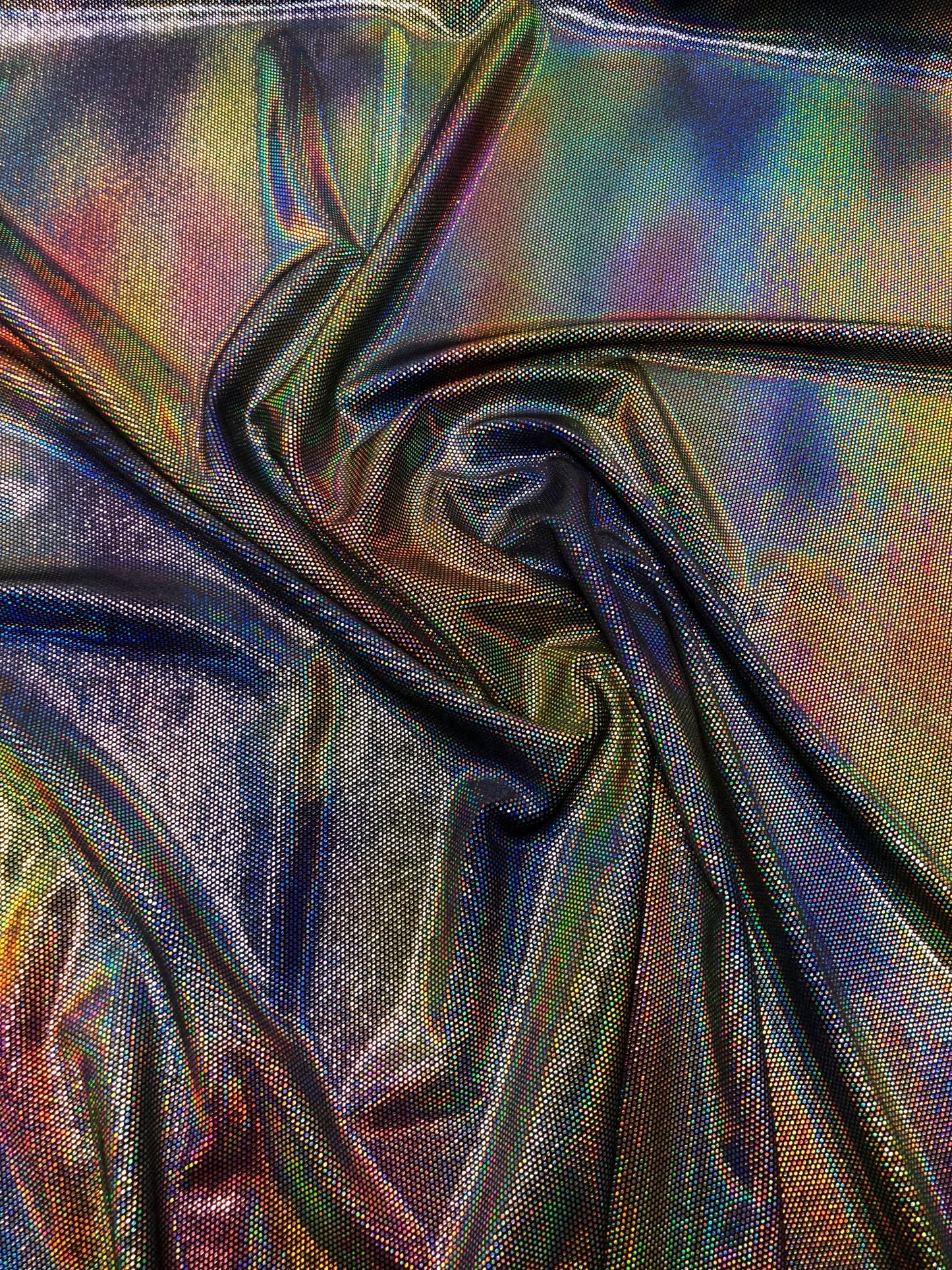 New iridescent lava foil on stretch velvet 4way Stretch 58/60" Sold by the YD. Ships worldwide from Los Angeles California USA.
