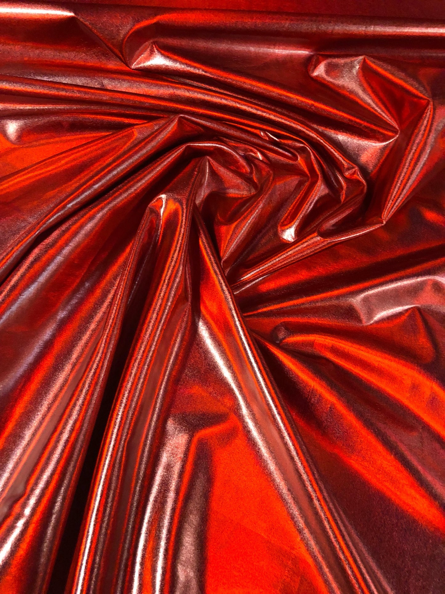 New iridescent red all over foil metallic nylon spandex 4way stretch 58/60" Sold bu the YD. Ships worldwide from Los Angeles California USA