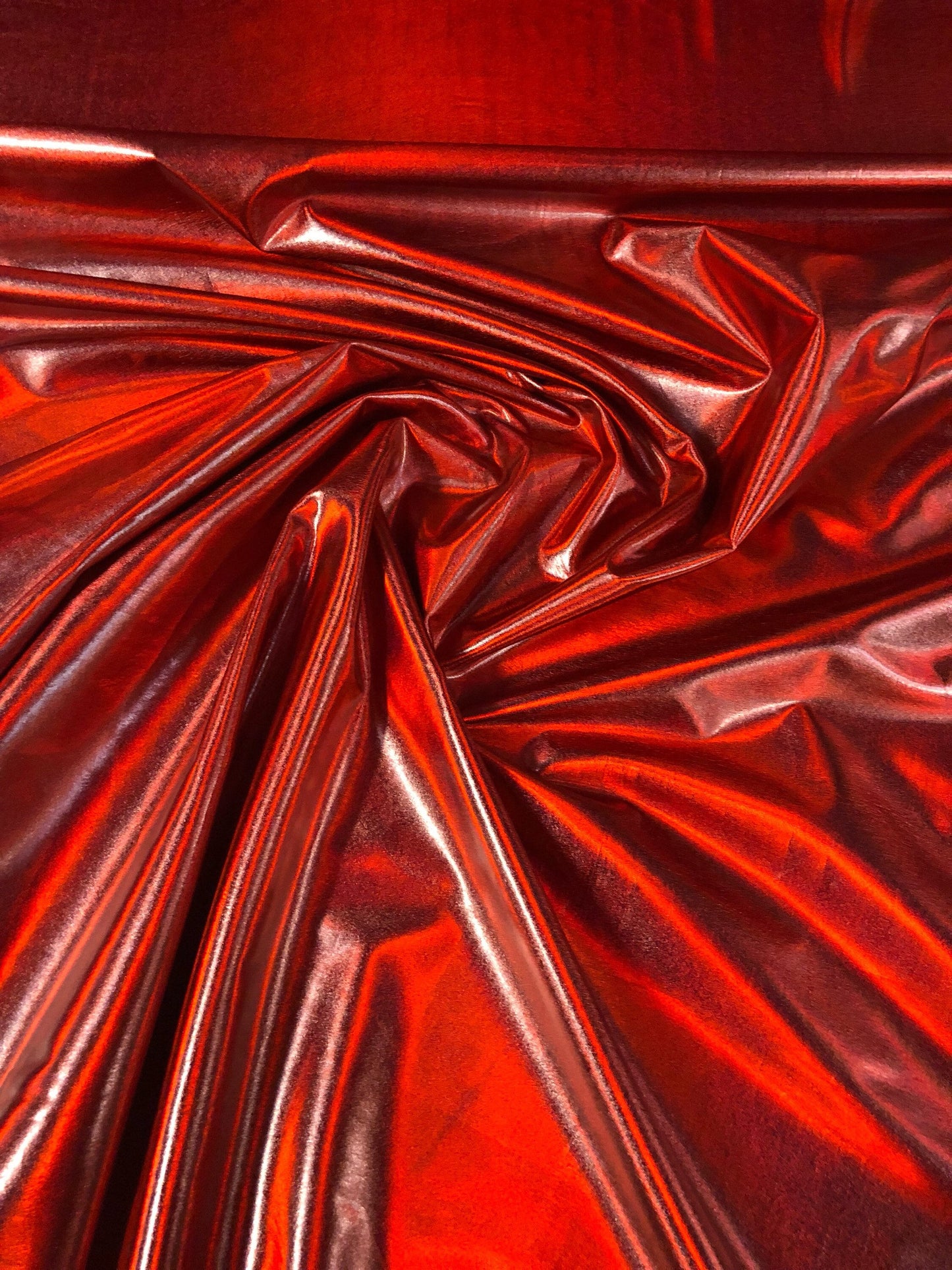 New iridescent red all over foil metallic nylon spandex 4way stretch 58/60" Sold bu the YD. Ships worldwide from Los Angeles California USA