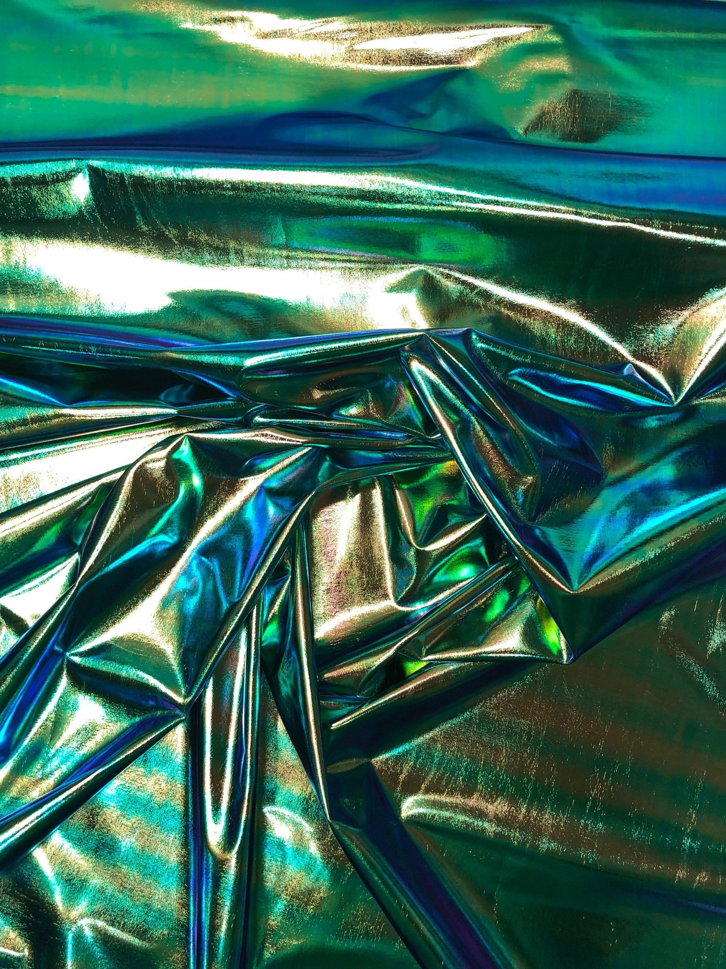 New iridescent foil blue/green all over foil 4way Stretch 58/60" Sold bybthe YD. Ships worldwide from Los Angeles California USA.
