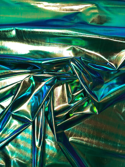 New iridescent foil blue/green all over foil 4way Stretch 58/60" Sold bybthe YD. Ships worldwide from Los Angeles California USA.