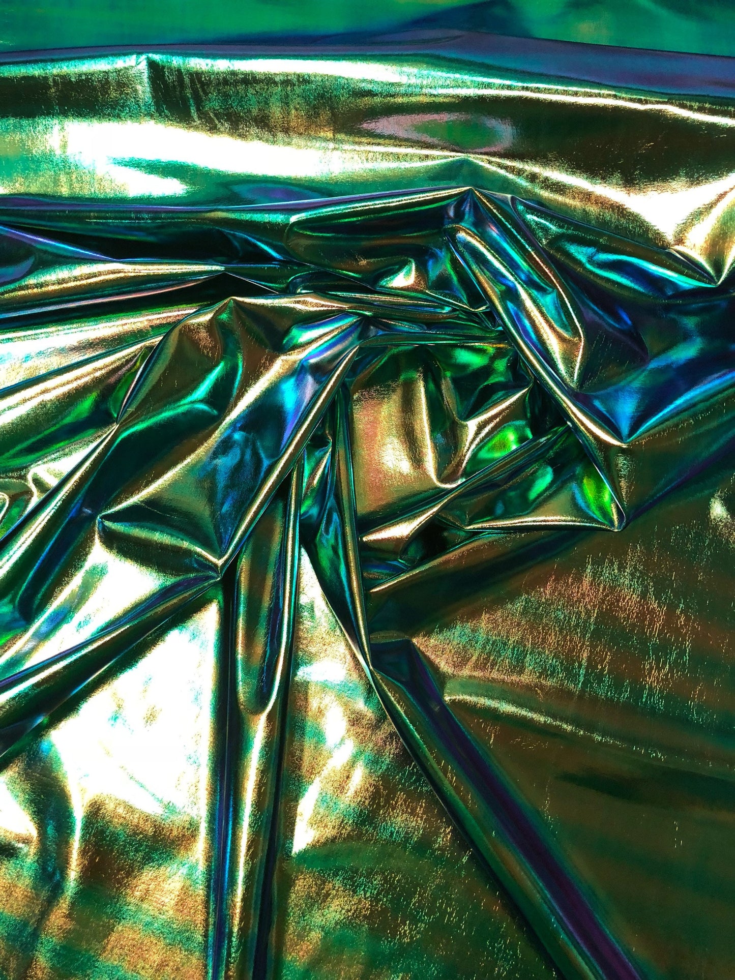 New iridescent foil blue/green all over foil 4way Stretch 58/60" Sold bybthe YD. Ships worldwide from Los Angeles California USA.
