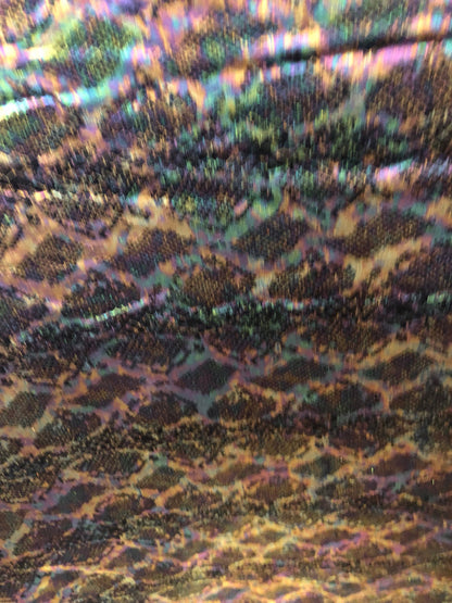 New iridescent snake design with iridescent foil 2way Stretch 58/60" Sold bubthe YD. Ships worldwide from Los Angeles California USA.