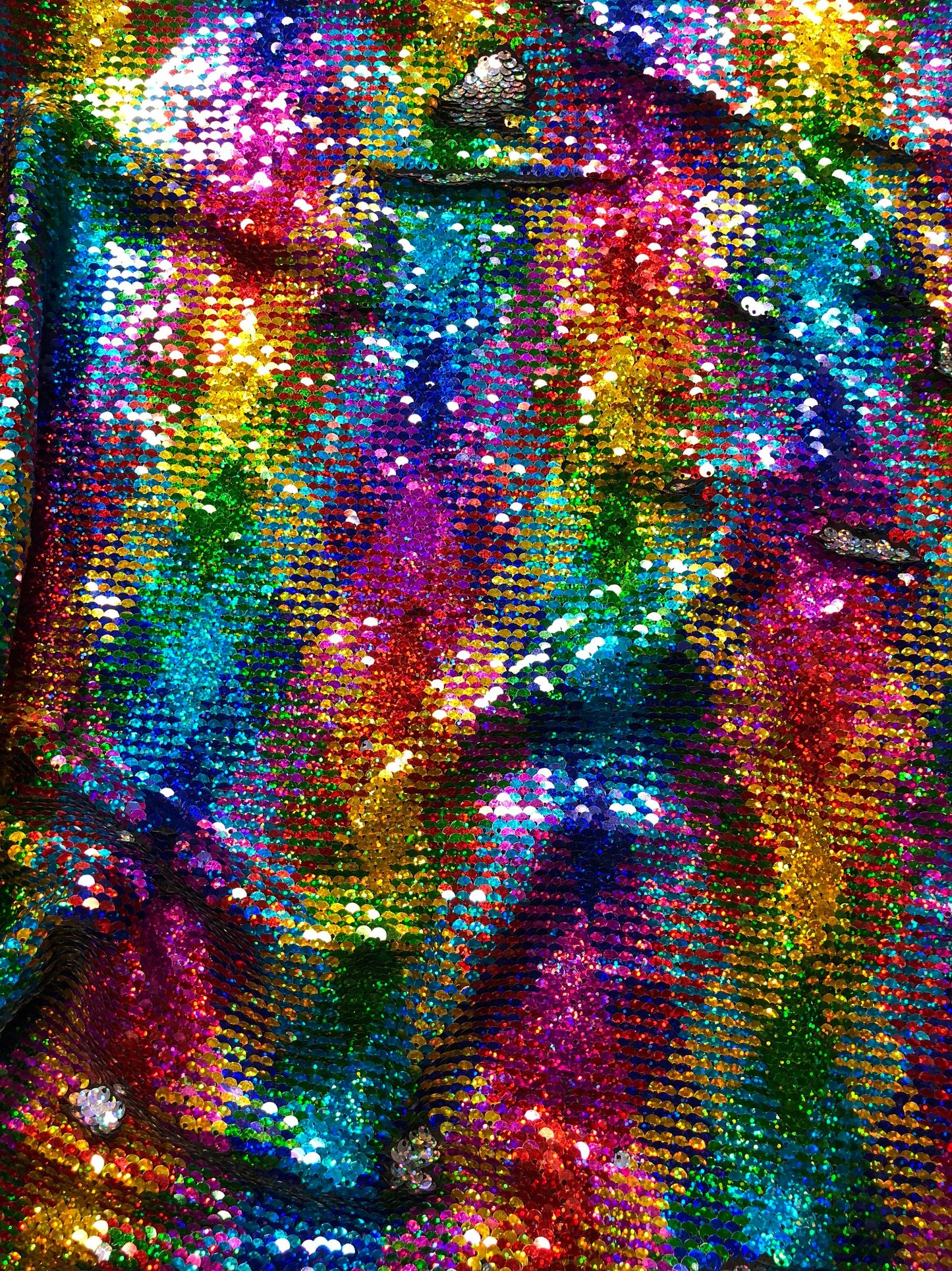 New rainbow sequins mermaid reversible sequins rainbow/silver on spandex base 58/60" Sold by the YD. Ships Worldwide from Los Angeles CA USA