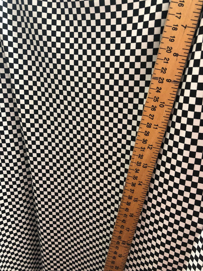 Small checkers design on poly spandex medium weight 58/60" Sold by the YD. Ships Worldwide from Los Angeles California USA.