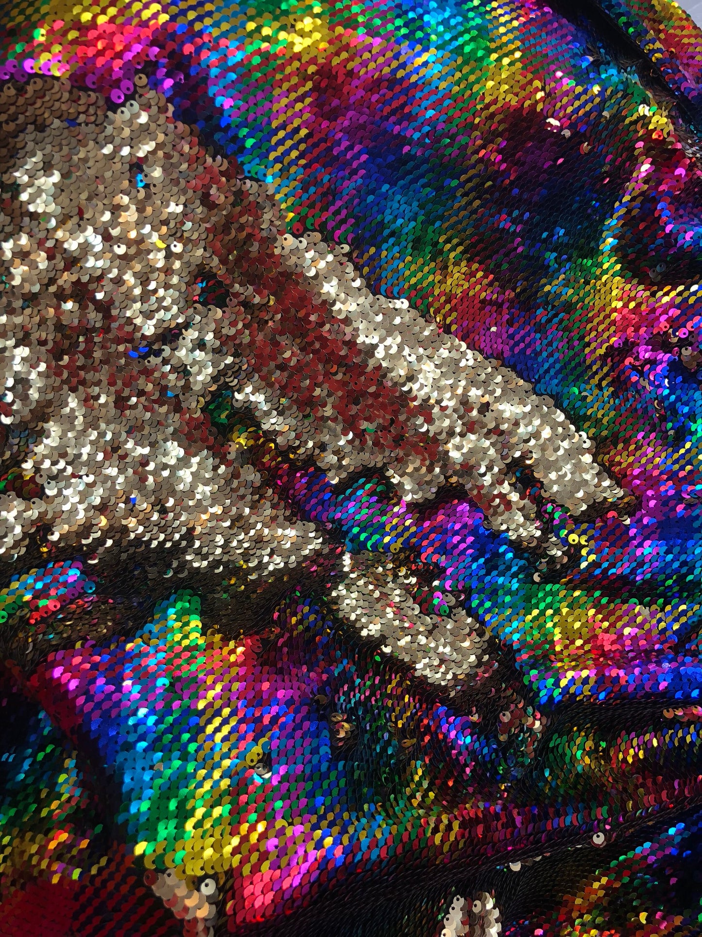 New hologram rainbow/gold reversible sequins on spandex base 2way Stretch 58/60" Sold by the YD. Ships worldwide from Los Angeles CA USA.