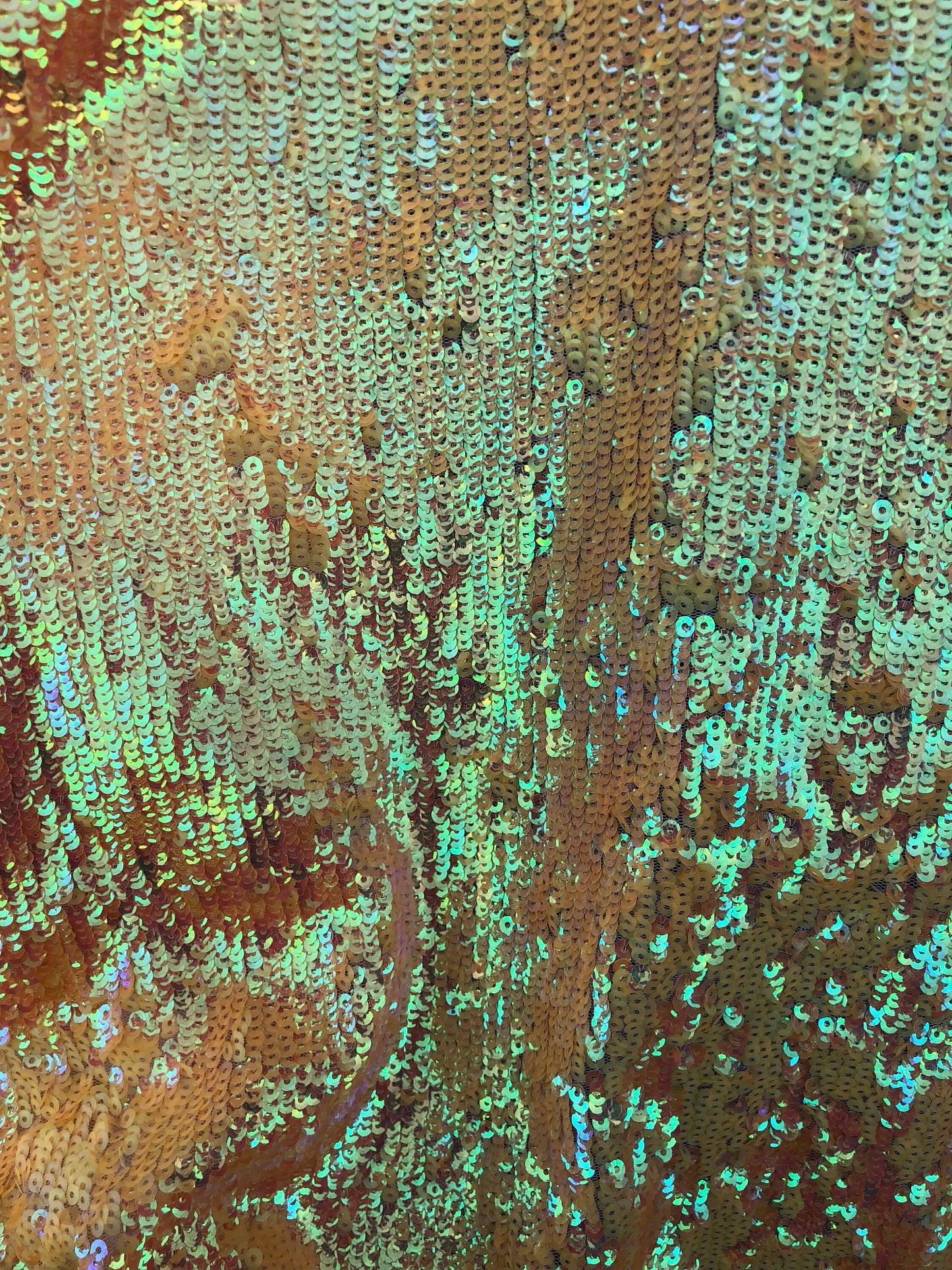 New sequins iridescent orange coral on stretch mesh 2way 58/60" Sold by the YD. Ships worldwide from Los Angeles California USA.