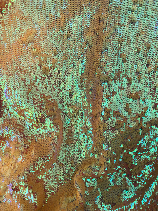 New sequins iridescent orange coral on stretch mesh 2way 58/60" Sold by the YD. Ships worldwide from Los Angeles California USA.