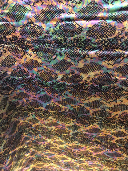 New iridescent snake design with iridescent foil 2way Stretch 58/60" Sold bubthe YD. Ships worldwide from Los Angeles California USA.