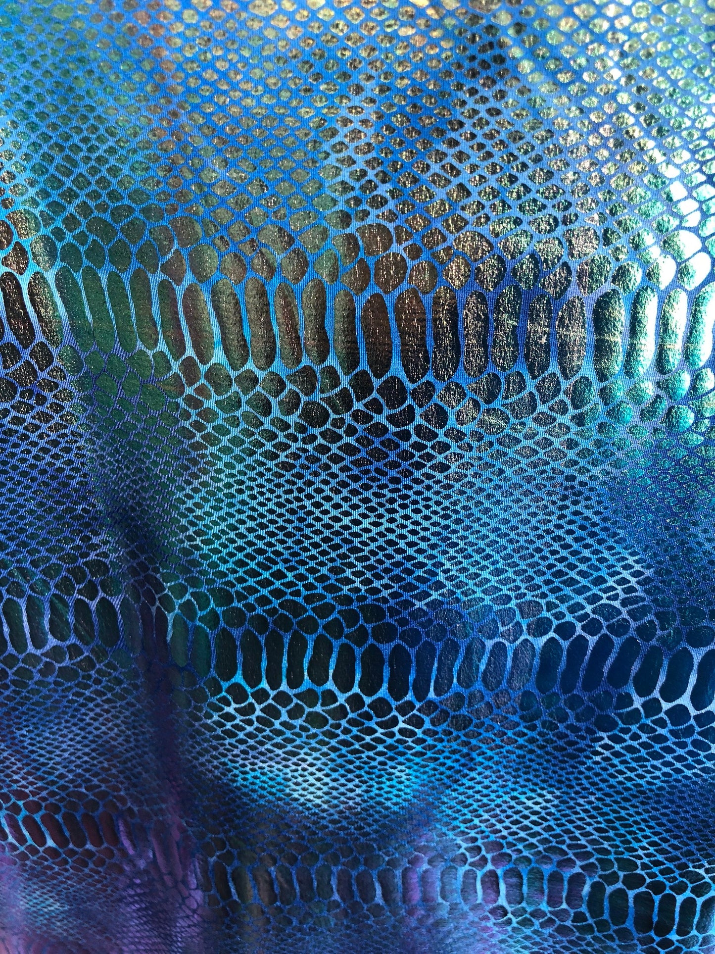 New iridescent metallic nylon spandex dragon design 4way stretch 58/60" Sold by the YD. Ships worldwide from Los Angeles California USA.