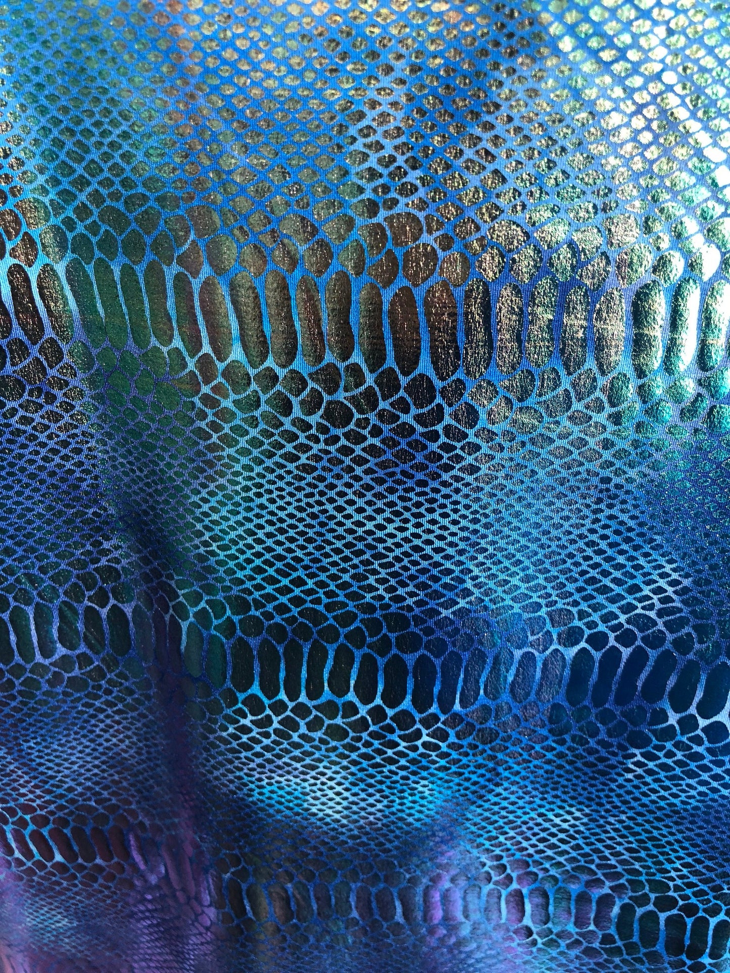 New iridescent metallic nylon spandex dragon design 4way stretch 58/60" Sold by the YD. Ships worldwide from Los Angeles California USA.